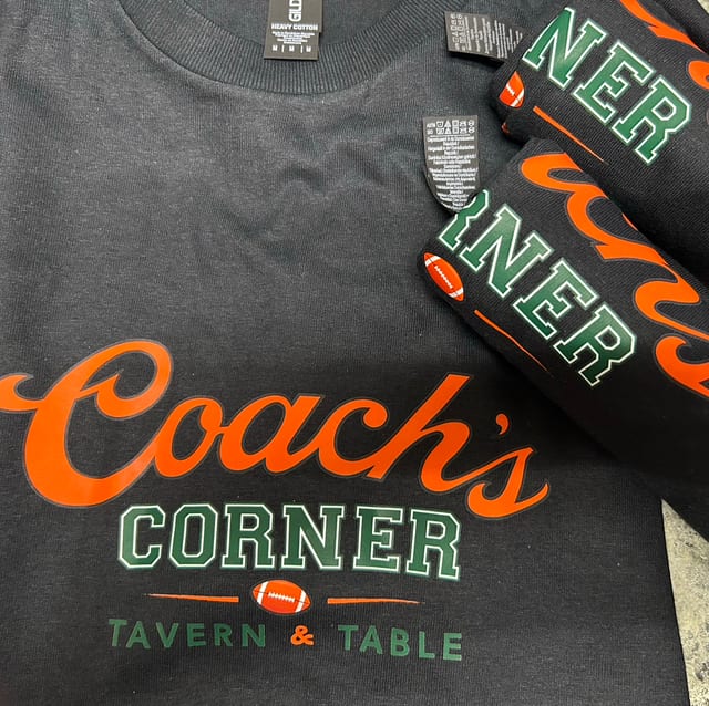 Coach's Corner Logo Unisex T-shirt Black.